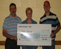 Treasurer Pat Clarke presenting Club Lotto winner Sean Kane with a cheque for 10,000. Sean, a Navan OMahony's supporter, purchased the winning Lotto ticket while attending a match in Seneschalstown