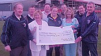 Mrs Marie Molly Recieving a cheque for �20,000 as winner of the Lotto Jackpot recently