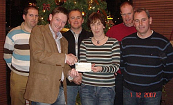 John O Hagan presents Marie Cahill with a cheque for �7640, which she won in the Carnmore/Claregalway G.A.A. club Lotto on 19th November 2007.