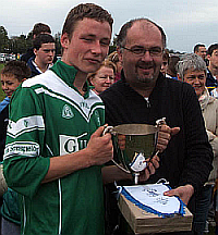 Lucan Under 15 Captain Brian Creed accepts the B Championship cup on behalf of his team, dedicating it to the memory of Seamus Morris RIP. who managed this team until his untimely illness in 2004.